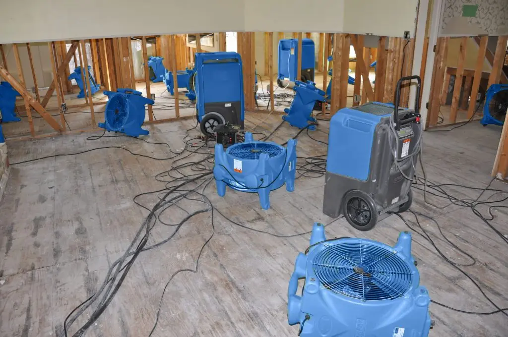 Air movers drying a gutted Salt Lake City room after major water damage